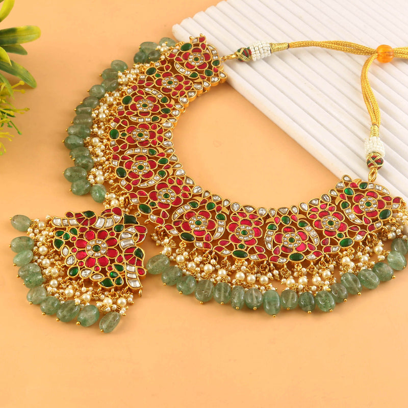 Jadau Kundan Necklace Set is beautifully handcrafted with premium Kundan stones in a classic Jadau setting. Inspired by the royal heritage of Rajasthan and Mughal artistry, this elegant set includes a matching pair
