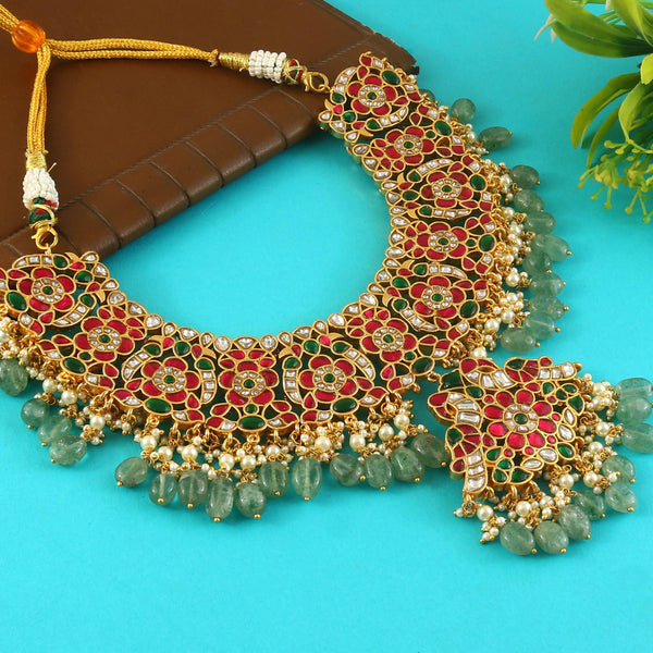 Jadau Kundan Necklace Set is beautifully handcrafted with premium Kundan stones in a classic Jadau setting. Inspired by the royal heritage of Rajasthan and Mughal artistry, this elegant set includes a matching pair