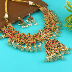 Jadau Kundan Necklace Set is beautifully handcrafted with premium Kundan stones in a classic Jadau setting. Inspired by the royal