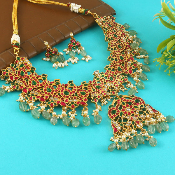 Jadau Kundan Necklace Set is beautifully handcrafted with premium Kundan stones in a classic Jadau setting. Inspired by the royal