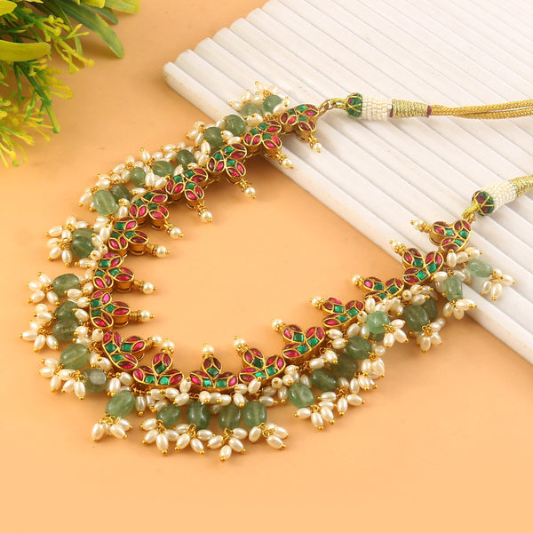 Jadau Kundan Necklace Set is beautifully handcrafted with premium Kundan stones in a classic Jadau setting. Inspired by the royal