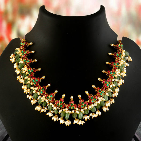 Jadau Kundan Necklace Set is beautifully handcrafted with premium Kundan stones in a classic Jadau setting. Inspired by the royal