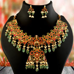 Jadau Kundan Necklace Set is beautifully handcrafted with premium Kundan stones in a classic Jadau setting. Inspired by the royal