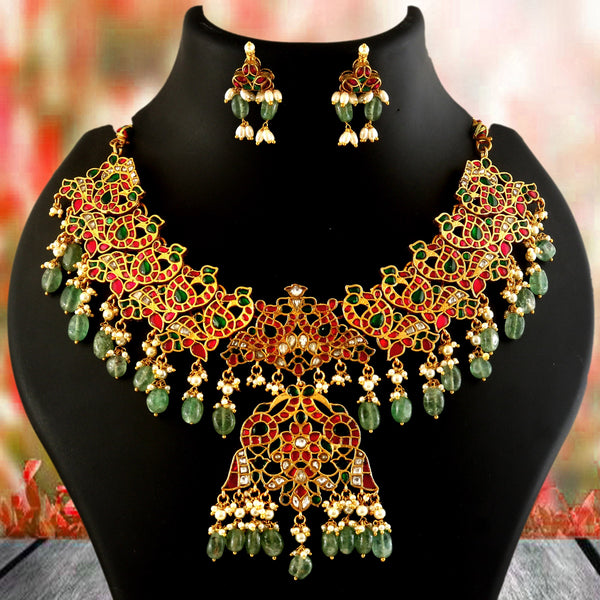 Jadau Kundan Necklace Set is beautifully handcrafted with premium Kundan stones in a classic Jadau setting. Inspired by the royal