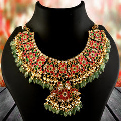 Jadau Kundan Necklace Set is beautifully handcrafted with premium Kundan stones in a classic Jadau setting. Inspired by the royal heritage of Rajasthan and Mughal artistry, this elegant set includes a matching pair