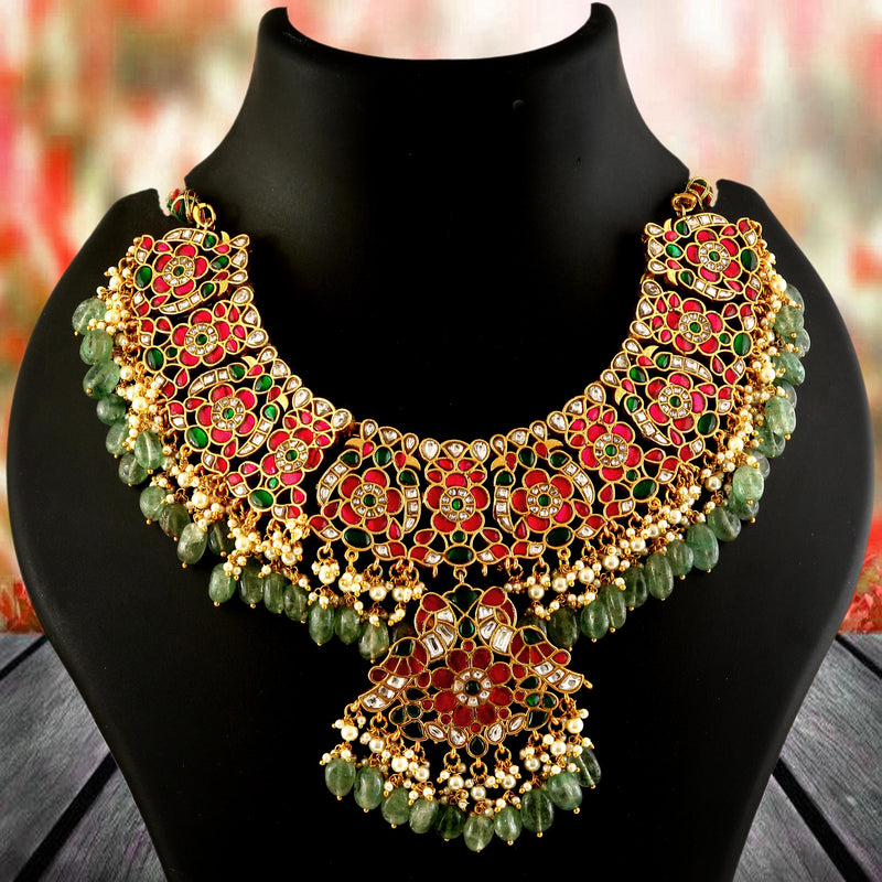Jadau Kundan Necklace Set is beautifully handcrafted with premium Kundan stones in a classic Jadau setting. Inspired by the royal heritage of Rajasthan and Mughal artistry, this elegant set includes a matching pair